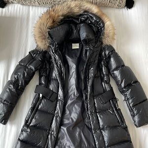 SAM women’s black down puffer parka with fur hood.